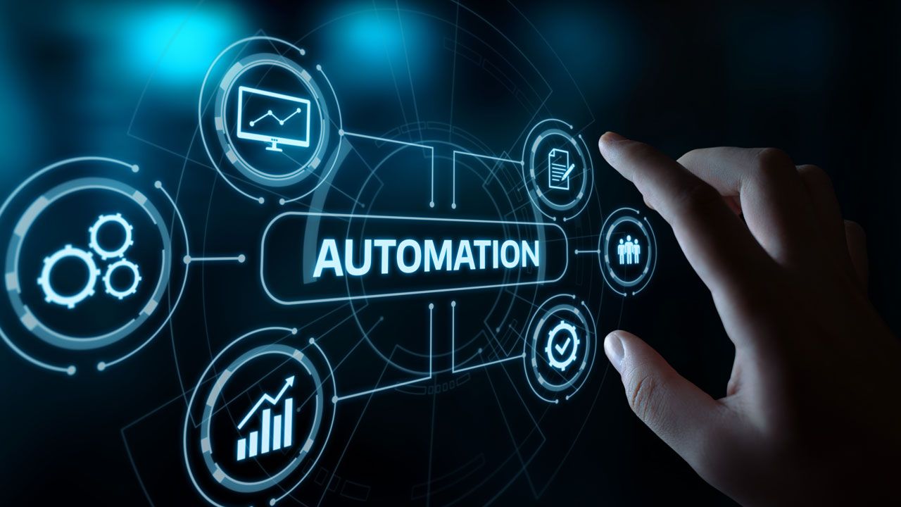 Technology risk and audit professionals reviewing automated control monitoring dashboards